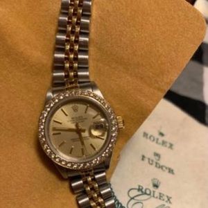 Ladies 18 K yellow gold and stainless steel diamond bezel champagne dial